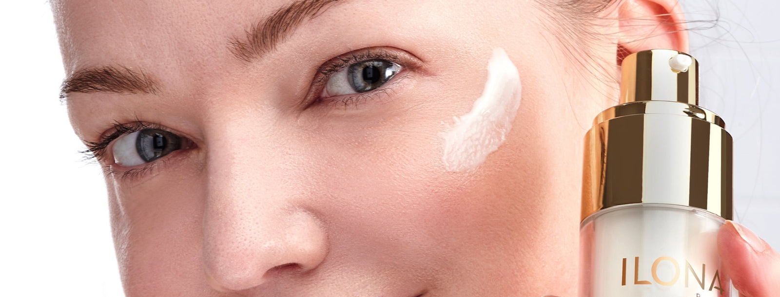 Model with swatch of ILONA Bottom Lines Face on cheek.