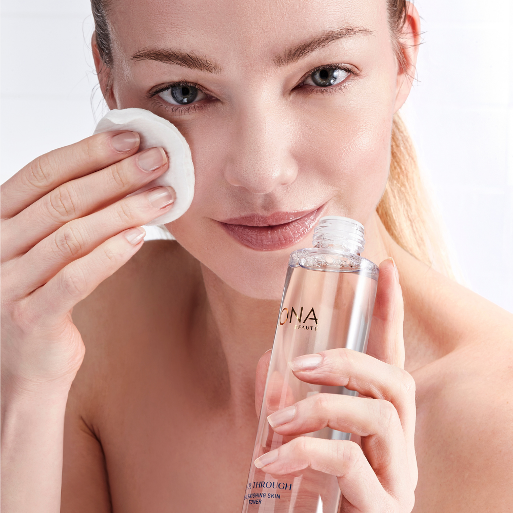 ILONA Beauty Clear Through Replenishing Skin Toner on Cotton Pad on Model